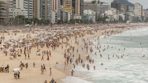 Crowded Beach full of happy people in Rio De Janeiro, Brazil.