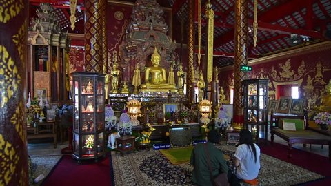 Chiang Mai, Circa February 2016. People praying to Buddha in Wat Chiang Man temple.