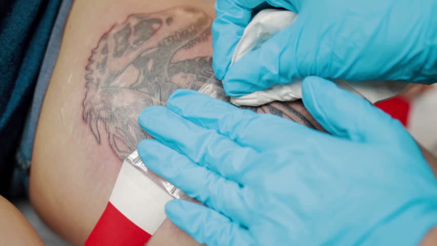 Tattoo artist finish to make tattoo at studio