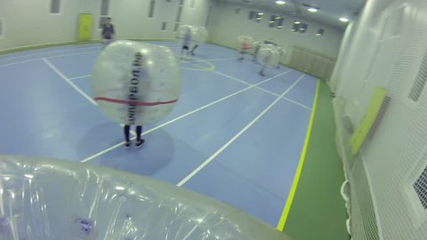 MOSCOW - SEP 23, 2015: (FPV) People play bumperball, New sport bumperball appeared in 2011 in Norway