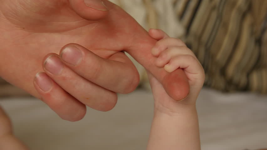 Baby holding on to Dads finger | Shutterstock HD Video #16744087