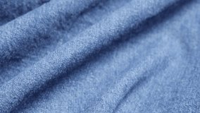 Detailed blue denim high quality and texture close-up  tilting 4K 2160p 30fps UltraHD video - Dungaree blue jeans cloth gathers close-up slow tilt 4K 3840X2160 UHD footage