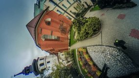 Crowd of People on Paving Stone, Old Bell Tower, Memorial, Flower Beds, vr Video 360, Little Planet Video, Video For Virtual Reality, Time Lapse, Red Bricks Building, Colorful Flowers, Vintage