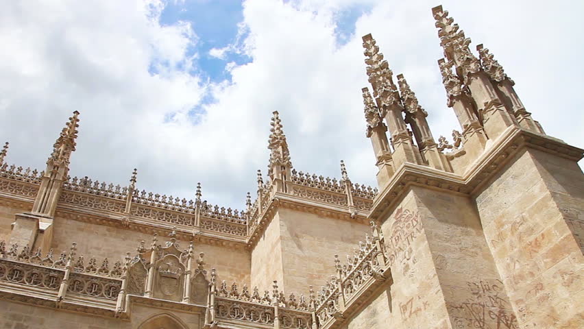 Sunny time lapse of moving clouds at Royal Chapel in Granada Cathedral, Granada town, Andalusia, Spain