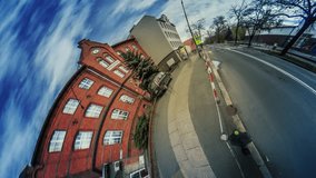 Buildings Along a Paved Road, Gate, Red and White Barrier, vr Video 360, Little Planet Video, Video For Virtual Reality, Time Lapse, Dark Clouds, Vintage Buildings, Leafless Trees, City Traffic,