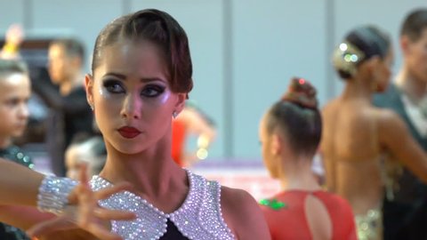 MOSCOW, RUSSIA - MAY 09, 2016: Beautiful girl with artistic makeup dancing in the ballroom. Close-up, slow motion. XIII world Dance Olympiad 2016.