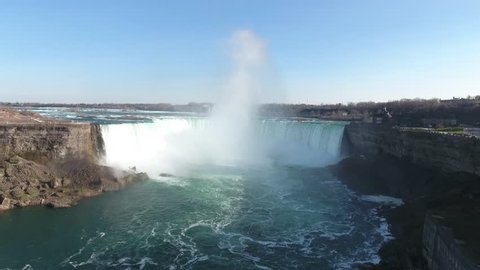 Spectacular flyover footage approaching, then hovering over, Niagara Falls from the most recognized and stunning view of the horseshoe.