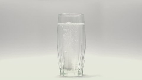 Aspirin Pill In Glass 3
Tablet of aspirin dissolving in glass of water.
Slow motion stock footage.