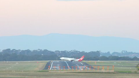 Melbourne, Australia - May 6, 2016: 4k video of Qantas airplane taking off at Melbourne Airport