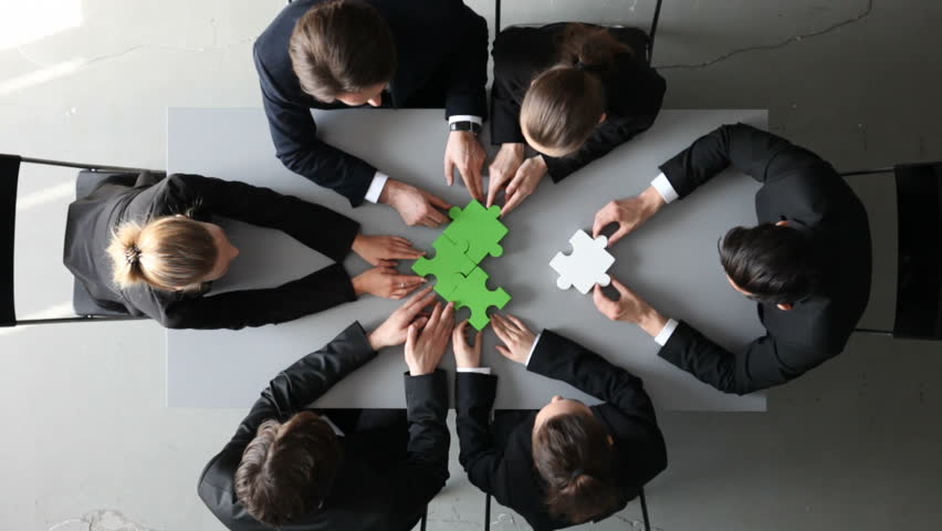 Group of business people assembling jigsaw puzzle and represent team support and help concept Royalty-Free Stock Footage #16771696