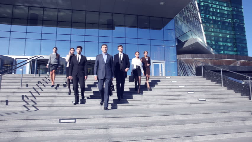 Group of business people walking down stairs outdoors Royalty-Free Stock Footage #16771699