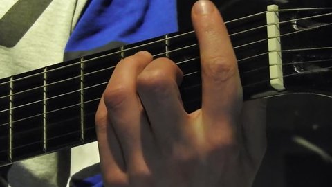 Playing Six-String Acoustic Guitar Big Hands on the Strings and Frets