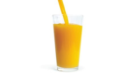 Orange Juice Pours Into Glass