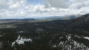 4K Aerial drone shot Sierra mountains highway reversed