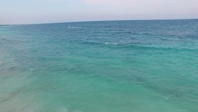 4K Aerial drone shot mexico tulum boat running from far