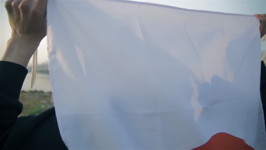 Japanese running man holding national flag while training for big games 