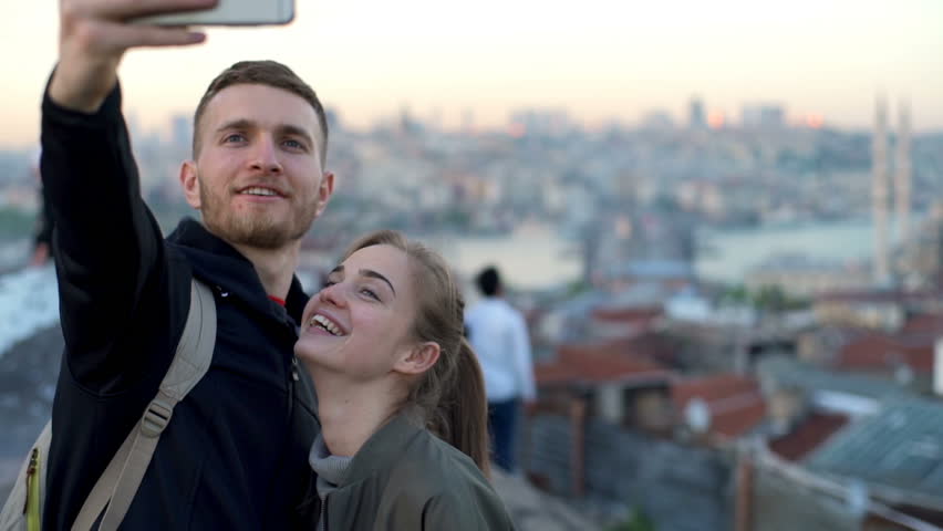 happy couple making selfie on a rooftop slow motion Royalty-Free Stock Footage #16800019