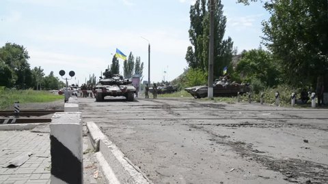 Lisichansk, Ukraine - 24 July, 2014: Ukrainian army during counter-terrorist operations in the East of Ukraine in 2014. Scraping by terrorists of the village.