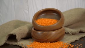 Red Lentils In A Wooden Bowl On The Table (Dolly Shot)