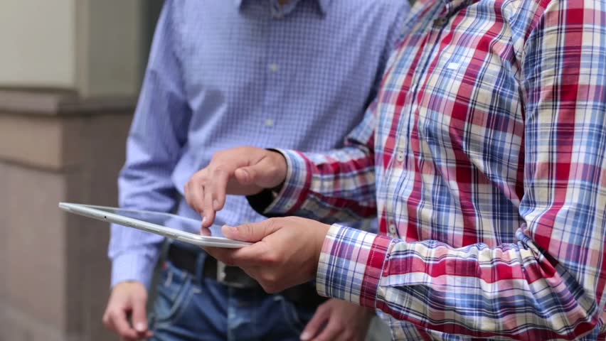 Meeting business partners on the street. Conducting meetings