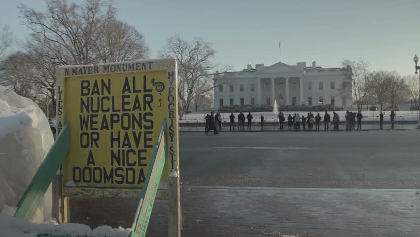 WASHINGTON, DC - JANUARY 2016: A protest sign outside the White House reads "Ban All Nuclear Weapons Or Have A Nice Doomsday."