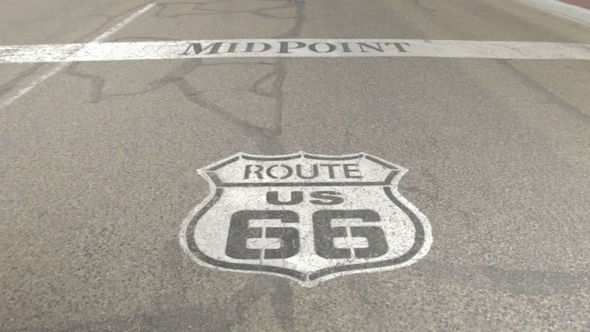 Route 66 midpoint sign painted on road. Adrian, Texas - USA: July, 2015
