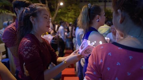 VUNG TAU - MARCH 26, 2016: Unidentified people stand during at night easter service in the Nha tho Vung Tau Catholic church in the downtown. Vietnam has the fifth largest Catholic population in Asia. 