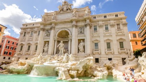 Daily time lapse in 4K: tourists and people walking next to the Trevi Fountain in a sunny day with clouds, one of the most famous fountain in the world. Rome, Lazio, Italy.