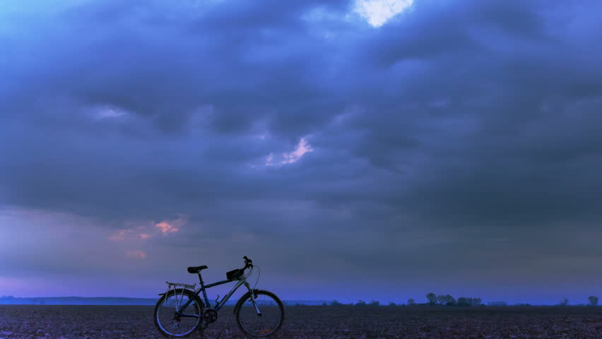 4K in Tourist team. Bicycle and clouds. Time lapse.