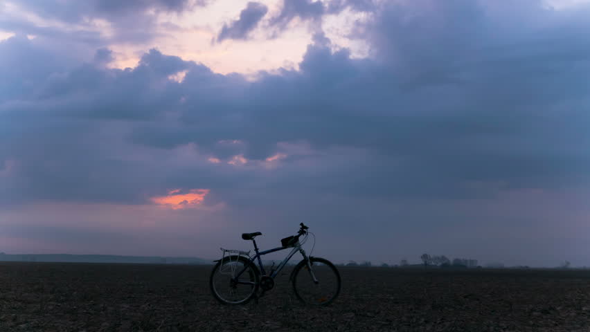4K in Tourist team. Bicycle and clouds. Time lapse.