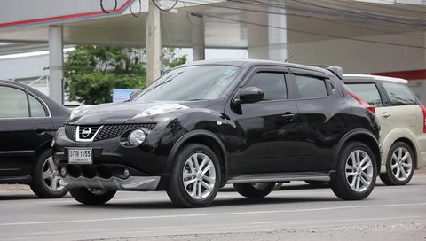 CHIANGMAI, THAILAND - MAY 21 2016:  Private car, Nissan Juke.  Clip at road no 1001 about 8 km from downtown Chiangmai, thailand.