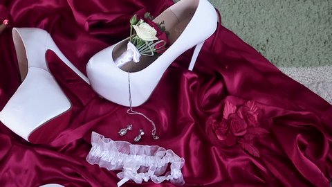brides shoes, garter, robe, bouquet