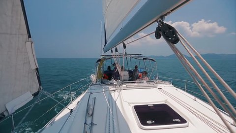 Yacht with crew moving in the sea