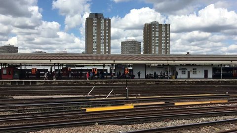 London, UK - 22nd May 2016: Commuters waiting for trains on Clapham junction railway station, London, England