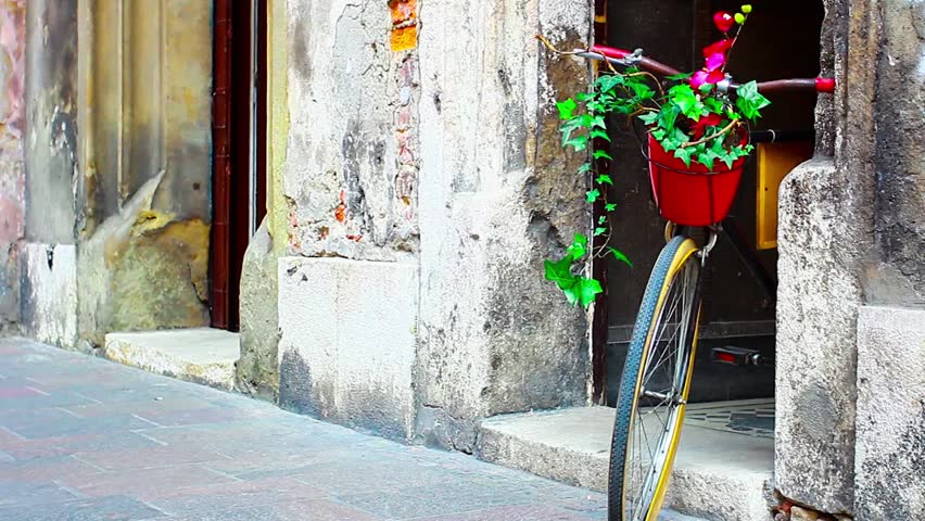 bike with flowers on the background of an old building