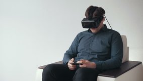 Man Wearing VR Headset and Playing Games with Controller