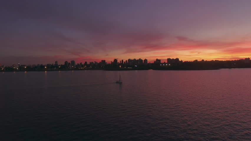 Buenos Aires, Argentina - November 23, 2015: Sailboat on Rio de la Plata at sunset, Buenos Aires, Argentina