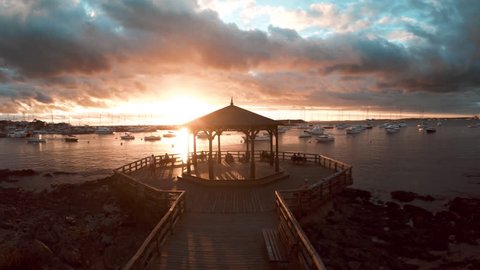 Punta del Este, Uruguay - March 16, 2015: Waterfront pavilion overlooking harbor at sunset, Punta del Este, Uruguay