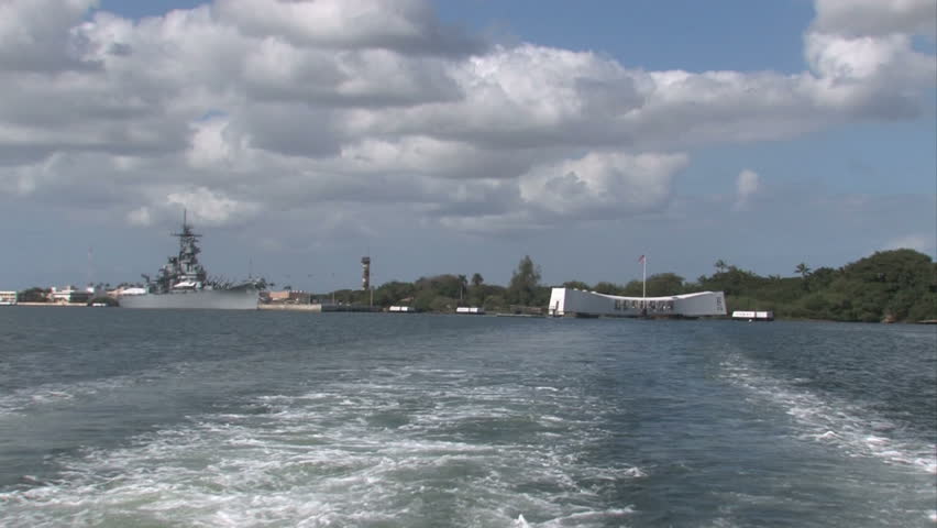  USS Arizona battleship Memorial. Pearl harbor, Honolulu, Hawaii., pov from boat. White memorial building floating on top of wreck of the battleship. Surprise attack by Japan started US in WW II. Honor and respect.