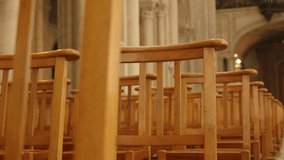 Empty cathedral wooden chairs in a row worship building 4K 3840X2160 30fps UltraHD footage - Row of wooden seats in Christian church 4K 2160p UHD video