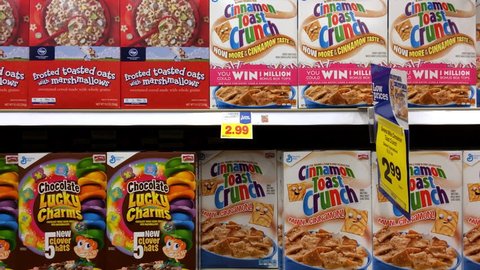 USA - CIRCA 2015: Multiple cereal options at grocery store aisle of Kroger store, displaying an every day breakfast of a child growing up in America.