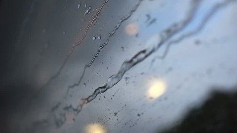 rain and light on window of moving vehicle modern travel concept 