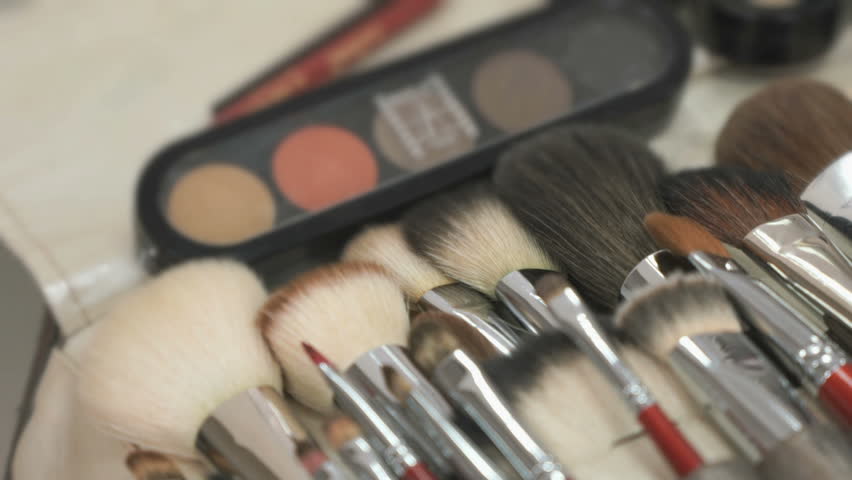 Make-up cosmetic palette and brushes on table | Shutterstock HD Video #16927102