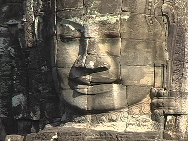 Carved stone face in Angkor Wat Cambodia
