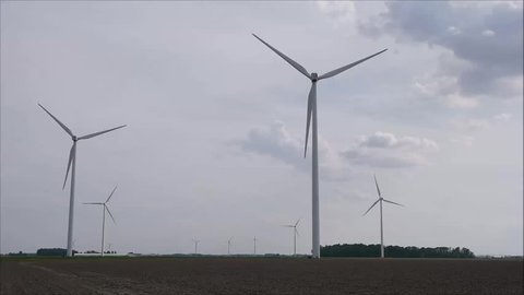 windmill farm in motion sky