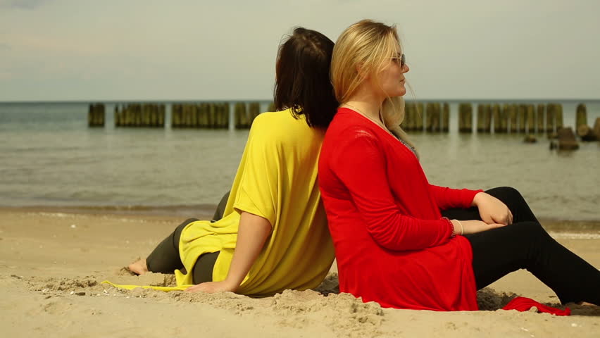 Girlfriends are relaxing at the beach
