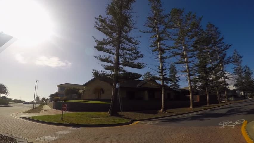 Adelaide, South Australia, vehicle POV driving through Henley Beach and Grange beachside suburbs, from The Esplanade and into Seaview Road, real time.  