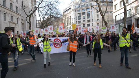 London, UK. 7th March 2015. EDITORIAL - Time To Act - Campaign for climate change protesters march through the streets of central London, to urge strong action at the Paris climate conference talks.