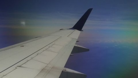 Slow motion view of an airplane wing in flight
