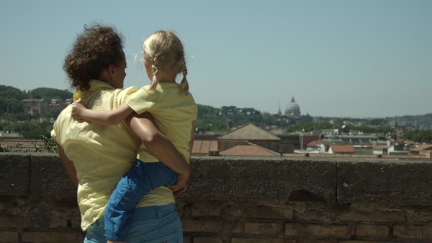 Mother and daughter enjoying the view in Rome, Italy, Europe